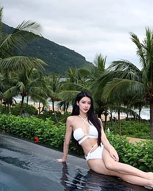 White bikini by the infinity pool'